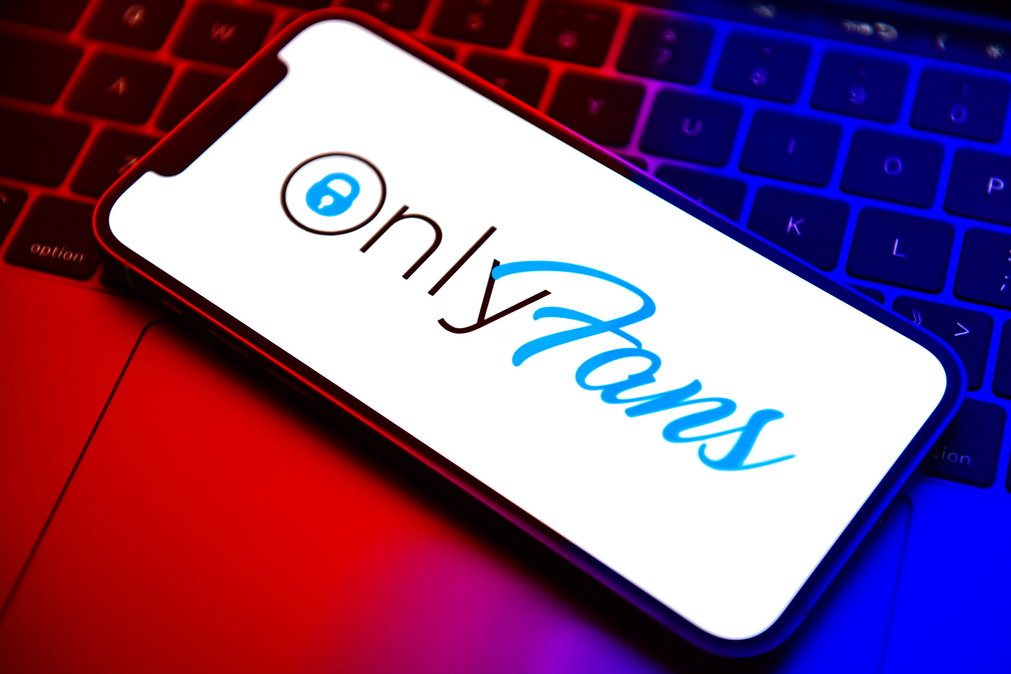 In this photo illustration, an OnlyFans logo seen displayed on a smartphone. (Photo Illustration by Sheldon Cooper/SOPA Images/LightRocket via Getty Images)