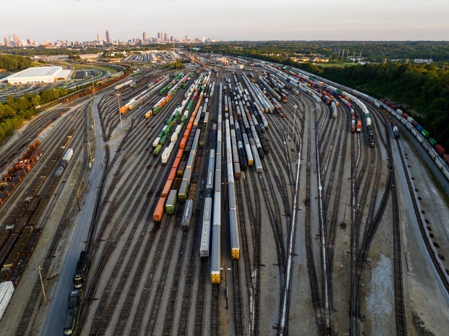 FILE - Freight train cars sit in a Norfolk Southern rail yard on Sept. 14, 2022, in Atlanta. Businesses are increasingly worried about the renewed threat of a railroad strike after two unions rejected their deals, and they want the White House and Congress to be ready to intervene. A coalition of 322 business groups sent a letter to President Joe Biden on Thursday, Oct. 27, 2022, urging him to make sure the deals he helped broker last month get approved because a railroad strike would have dire
 consequences for the economy. (AP Photo/Danny Karnik, File) ORG XMIT: NYSS412
