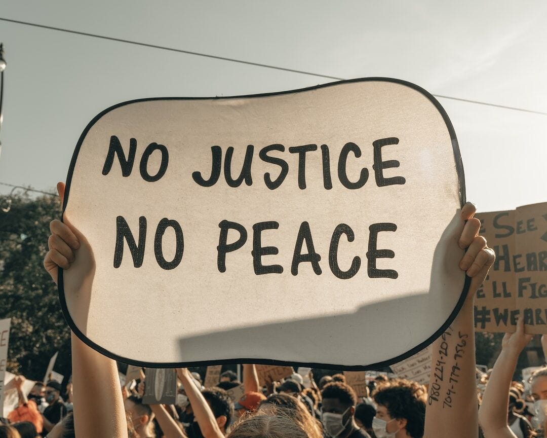 sign, no justice no peace