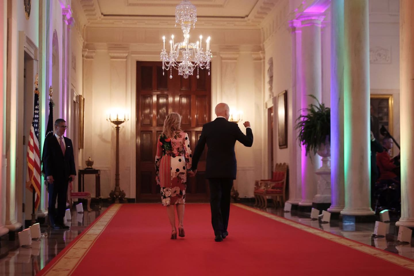 President Biden and first lady Jill Biden walked through the Cross Hall lit with rainbow colors following an event commemorating LGBTQ Pride Month in the East Room of the White House on Friday.