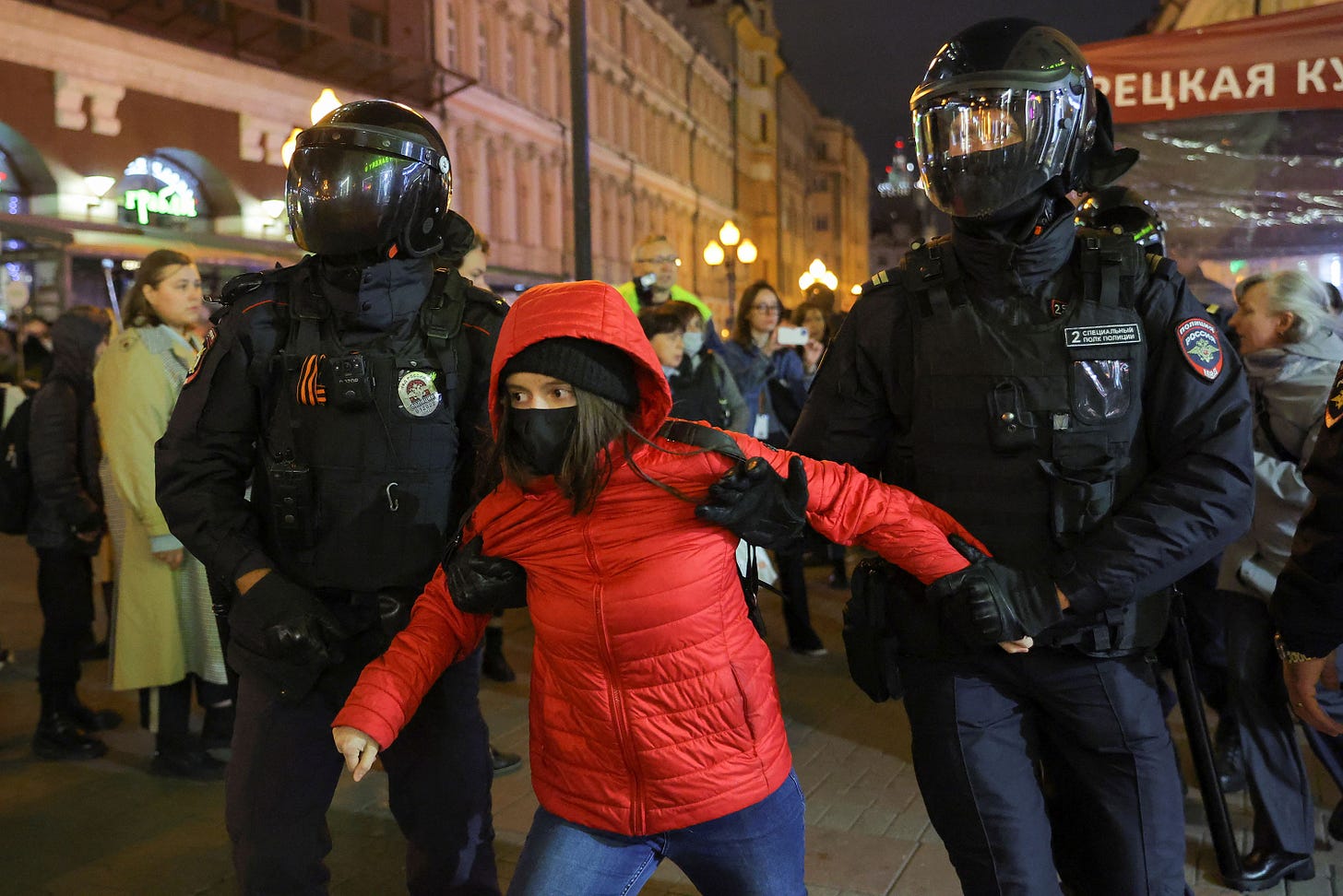 Russian police officers detain a person during a protest in Moscow on Wednesday.