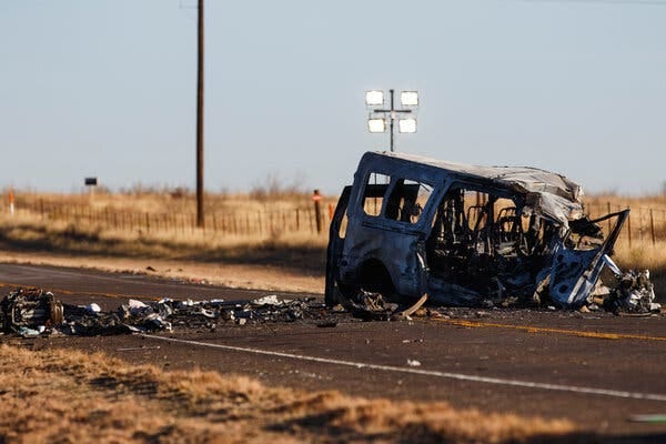 A damaged bus near the scene of a fatal wreck in Andrews County, Texas where nine people were killed.