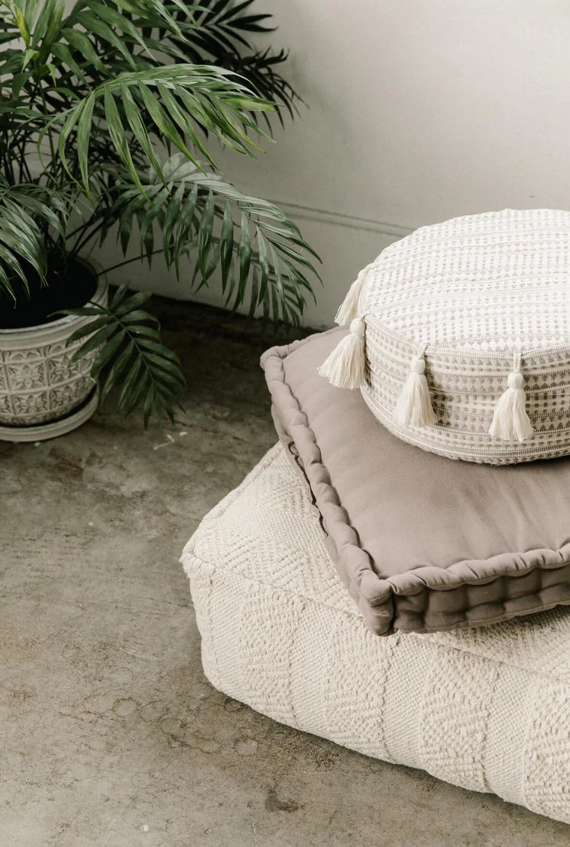 Cozy Home Yoga Corner with Mat, Candles, and Plants Stock Photo