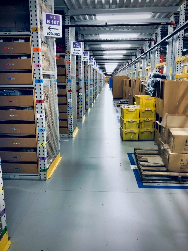 Amazon aisles of bins of inventory