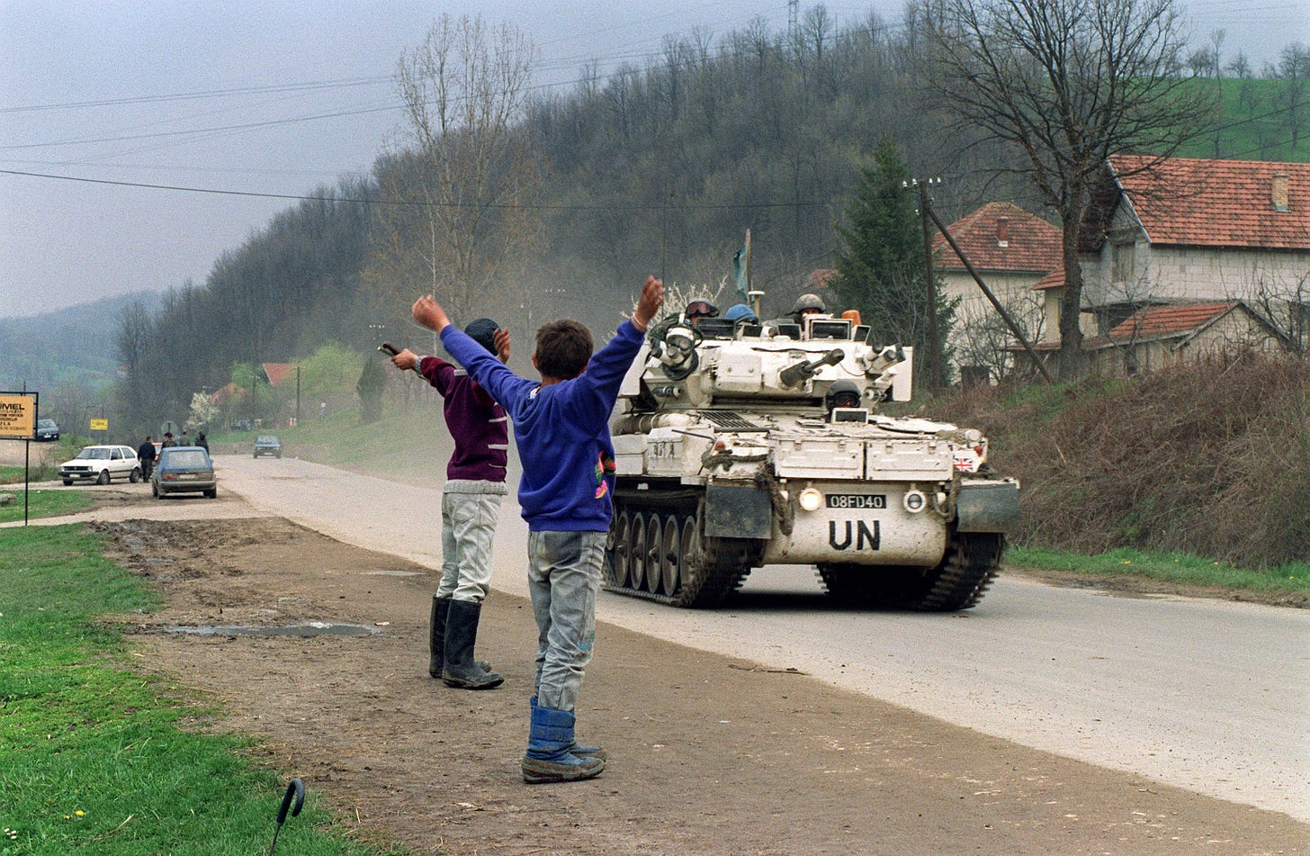 UN soldiers in an Infantry Fighting Vehicle (IFV) on patrol in Bosnia are warmly greeted by Bosnians.