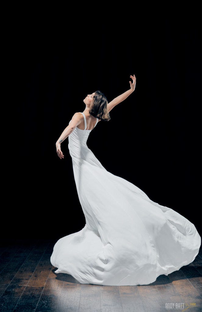 Ballerina with white dress flowing