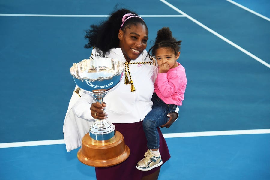 Serena Williams holds her daughter Alexis Olympia Ohanian Jr. and the championship trophy after winning the 2020 ASB Classic in Auckland, New Zealand.