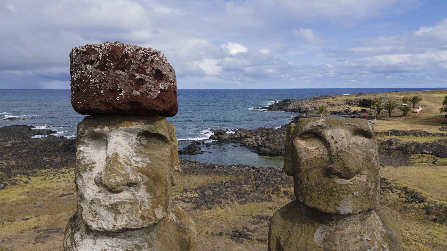 Moai statues stand on Ahu Tongariki, Rapa Nui, or Easter Island, Chile, Sunday, Nov, 27, 2022. Each monolithic human figure carved centuries ago by this remote Pacific island's Rapanui people represents an ancestor. (AP Photo/Esteban Felix)