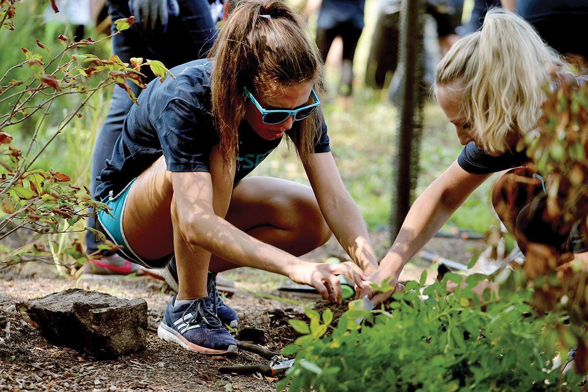 Image of girls planting flowers.