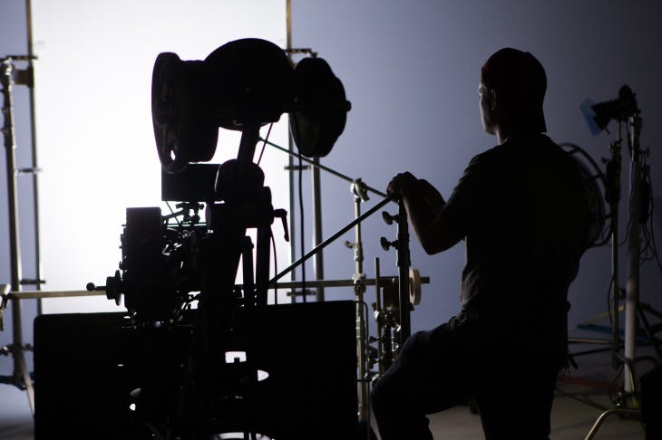 Camera operator in studio filming.