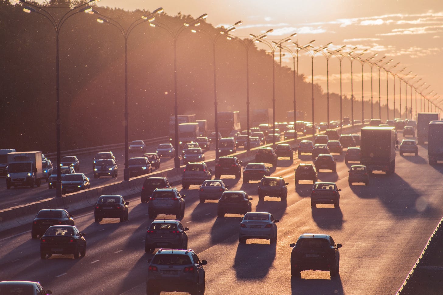 image of cars on a freeway making their way to work on a sunny morning