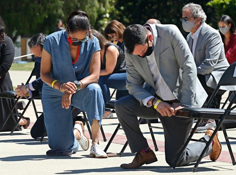 Assemblywoman Sydney Kamlager, left, and Assembly Speaker Anthony Rendon, right, join other members of the California Legislature as they kneel for 8 minutes and 46 second to honor George Floyd at the Capitol on June 9, 2020. Photo by Rich Pedroncelli, AP/Pool