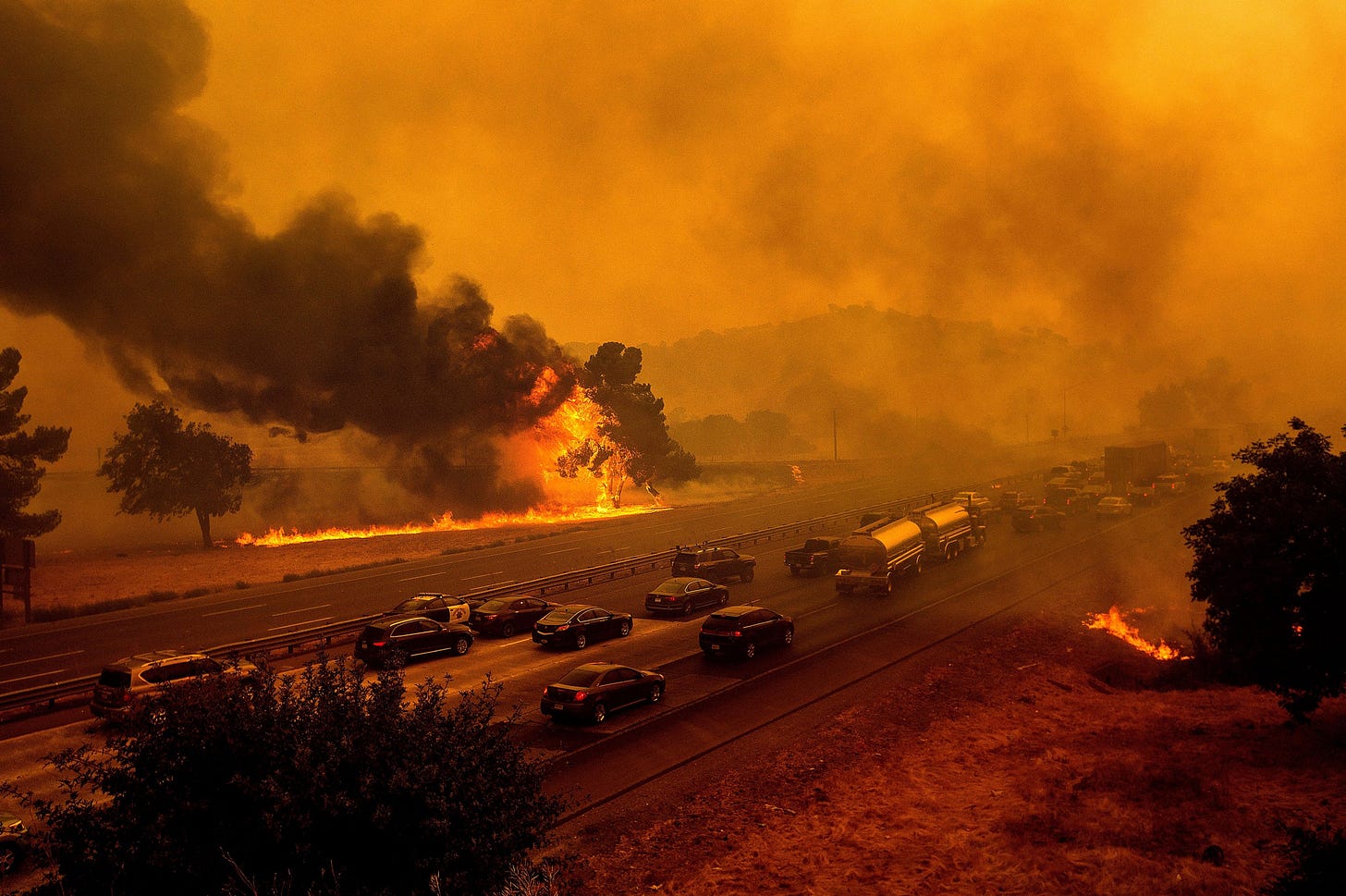 Fires on both sides of a busy highway.