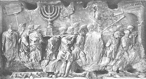 https://upload.wikimedia.org/wikipedia/commons/b/bf/Sack_of_jerusalem.JPG A carving of the Sack of Jerusalem by the romans. Many people in drapey toga fabric are carrying the menorah out of the Temple. 