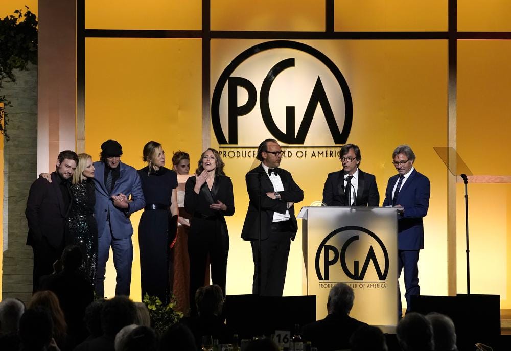 The Producing team and cast of "Coda" accept the Darryl F. Zanuck Award for Outstanding Producer of Theatrical Motion Pictures at the 33rd annual Producers Guild Awards on Saturday, March 19, 2022, at the Fairmont Century Plaza Hotel in Los Angeles. (AP Photo/Chris Pizzello)