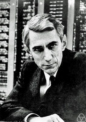 Photo of Claude Shannon in front of computer equipment. — https://opc.mfo.de/detail?photo_id=3807, CC BY-SA 2.0 de, https://c