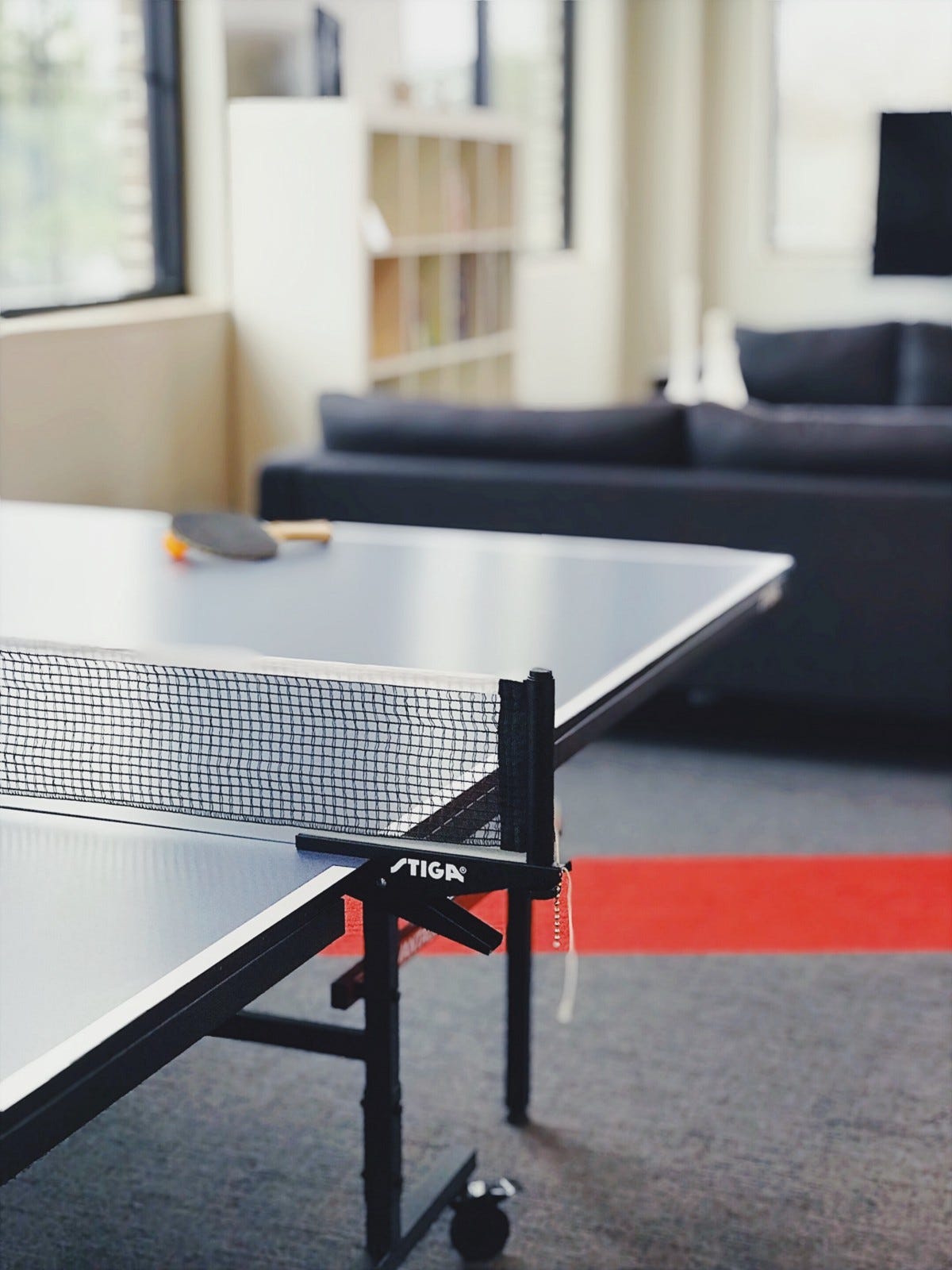 Image of a ping pong table in an office space