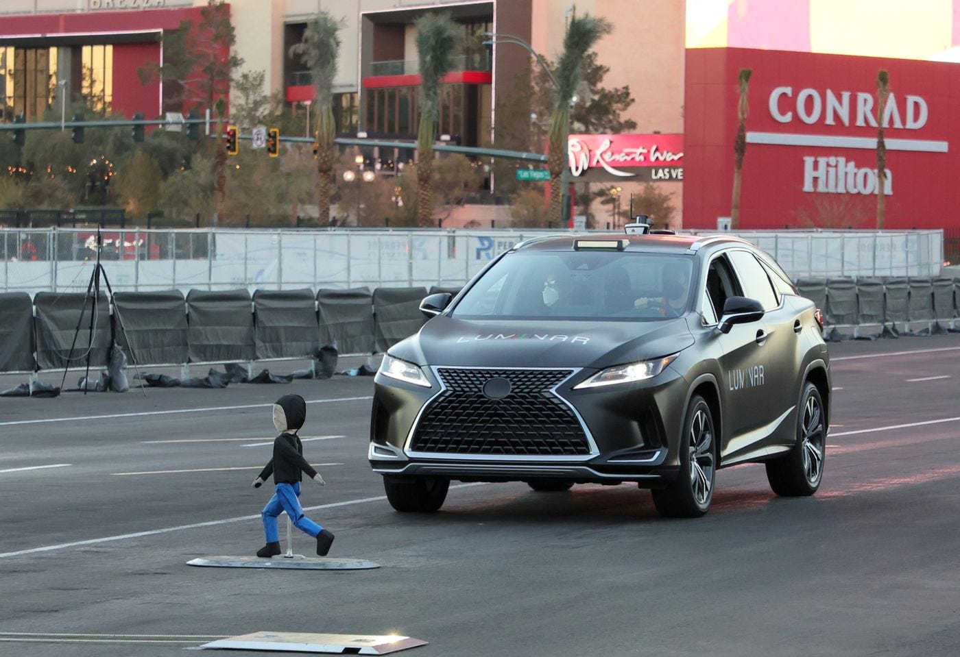A Lexus with automatic braking technology avoids colliding with a crash test dummy as part of a safety demonstration at the consumer technology trade show CES 2022 in January.&nbsp;