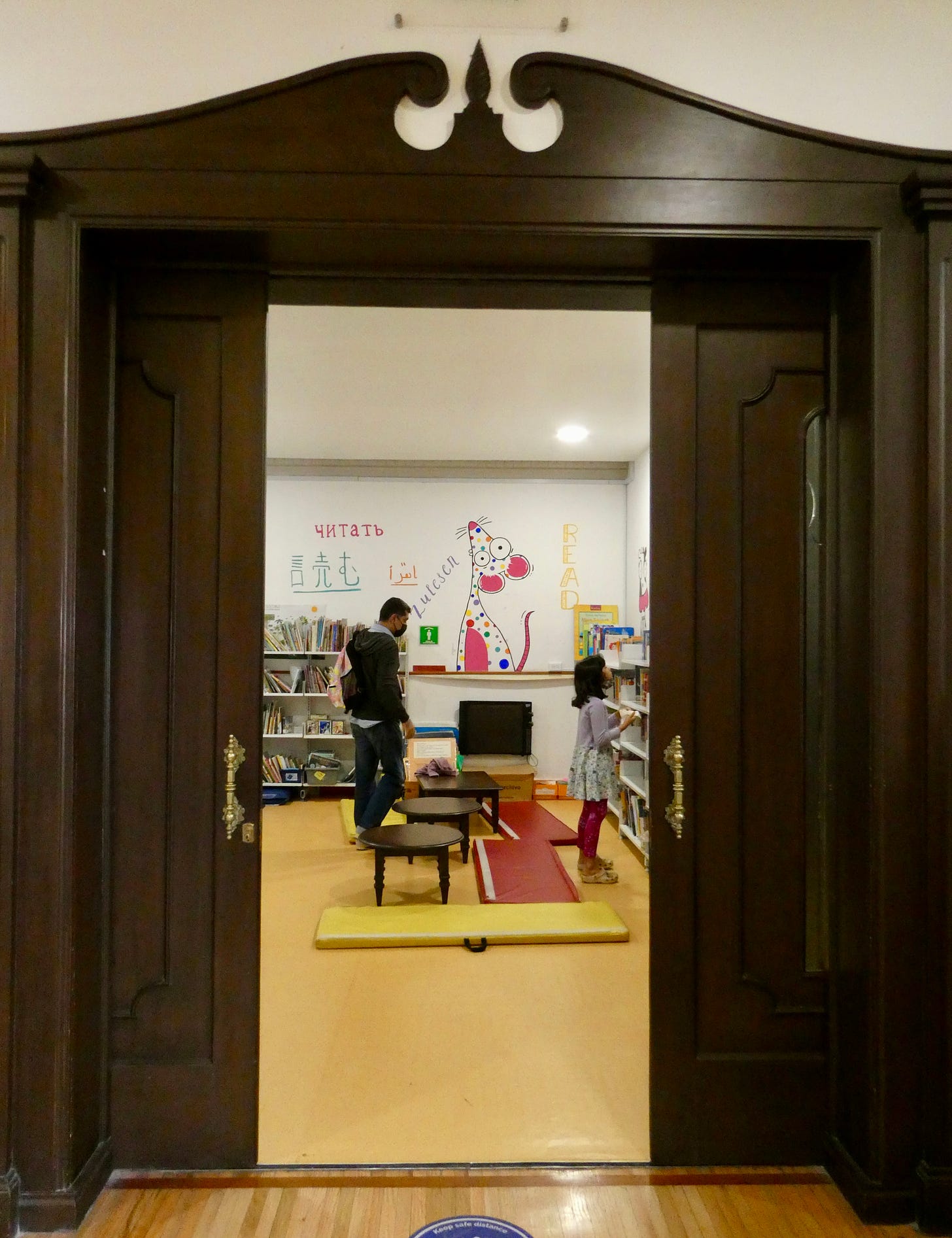 double doors open to show library inside