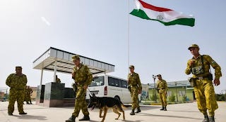 A group of soldiers walking a dog

Description automatically generated with medium confidence