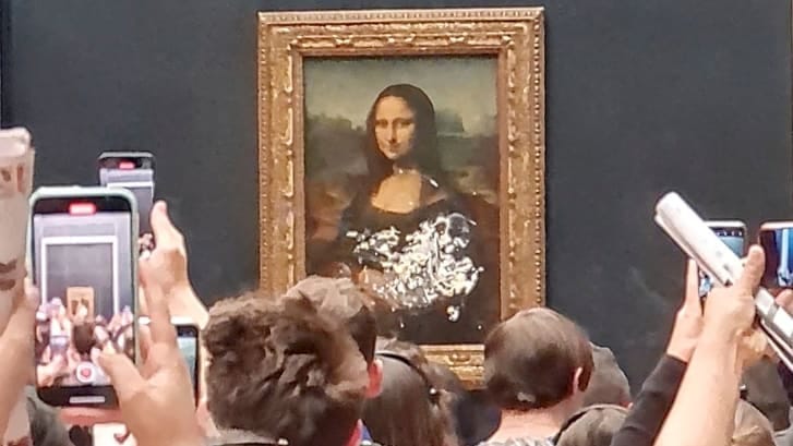 A visitor to the Louvre smeared cake on the glass protecting the Mona Lisa.
