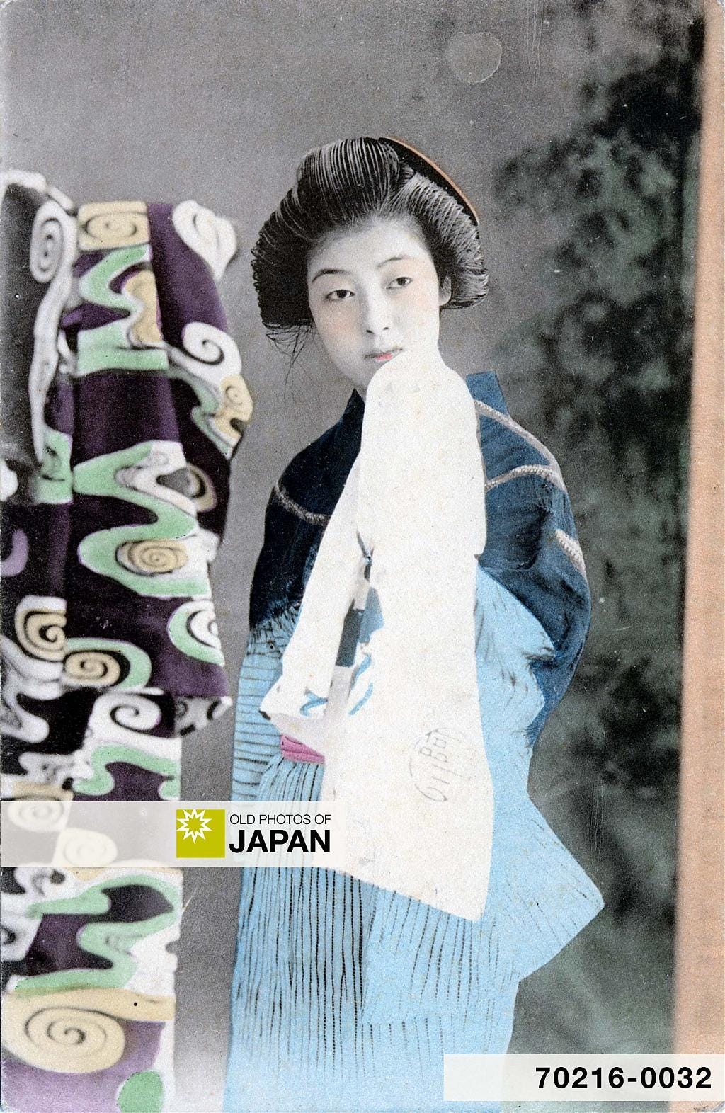 Japanese woman holding a typical Japanese bath towel