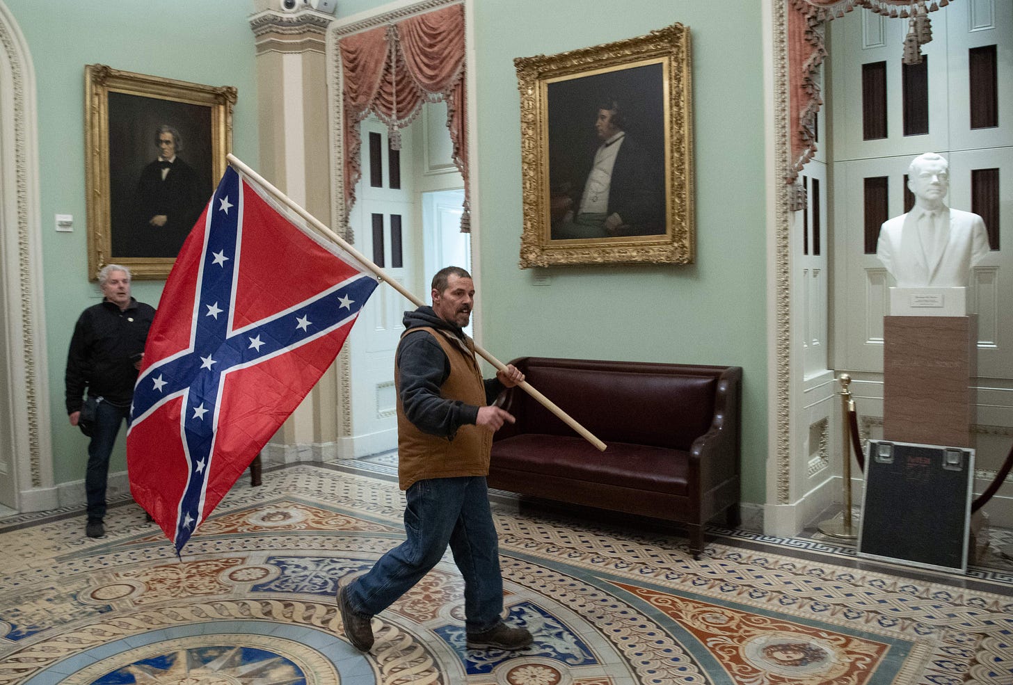 Man who carried Confederate flag to Capitol during riot indicted