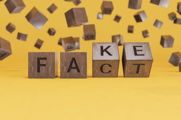 fake or fact concepts with wooden text alphabet block on yellow background - vérité photos et images de collection