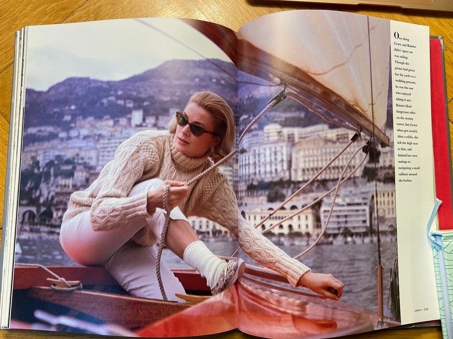GRACE by Howell Conant opened to a page of Grace Kelly posing on a sailboat in an Aran sweater.