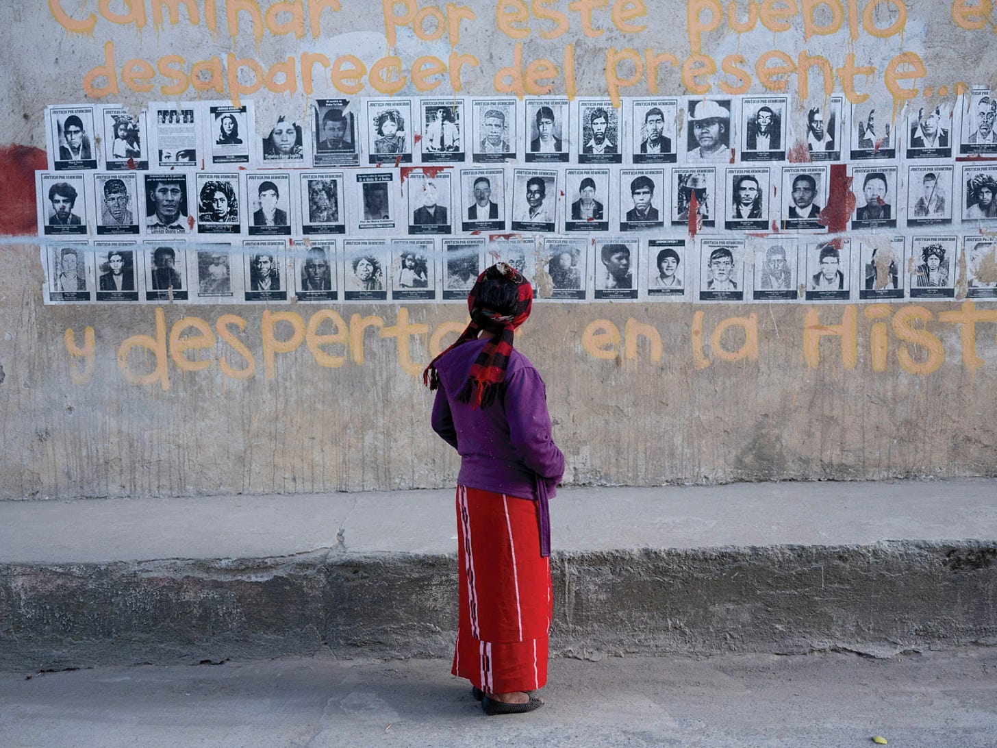 Pictures of disappeared civilians posted on a wall, Nebaj, Guatemala