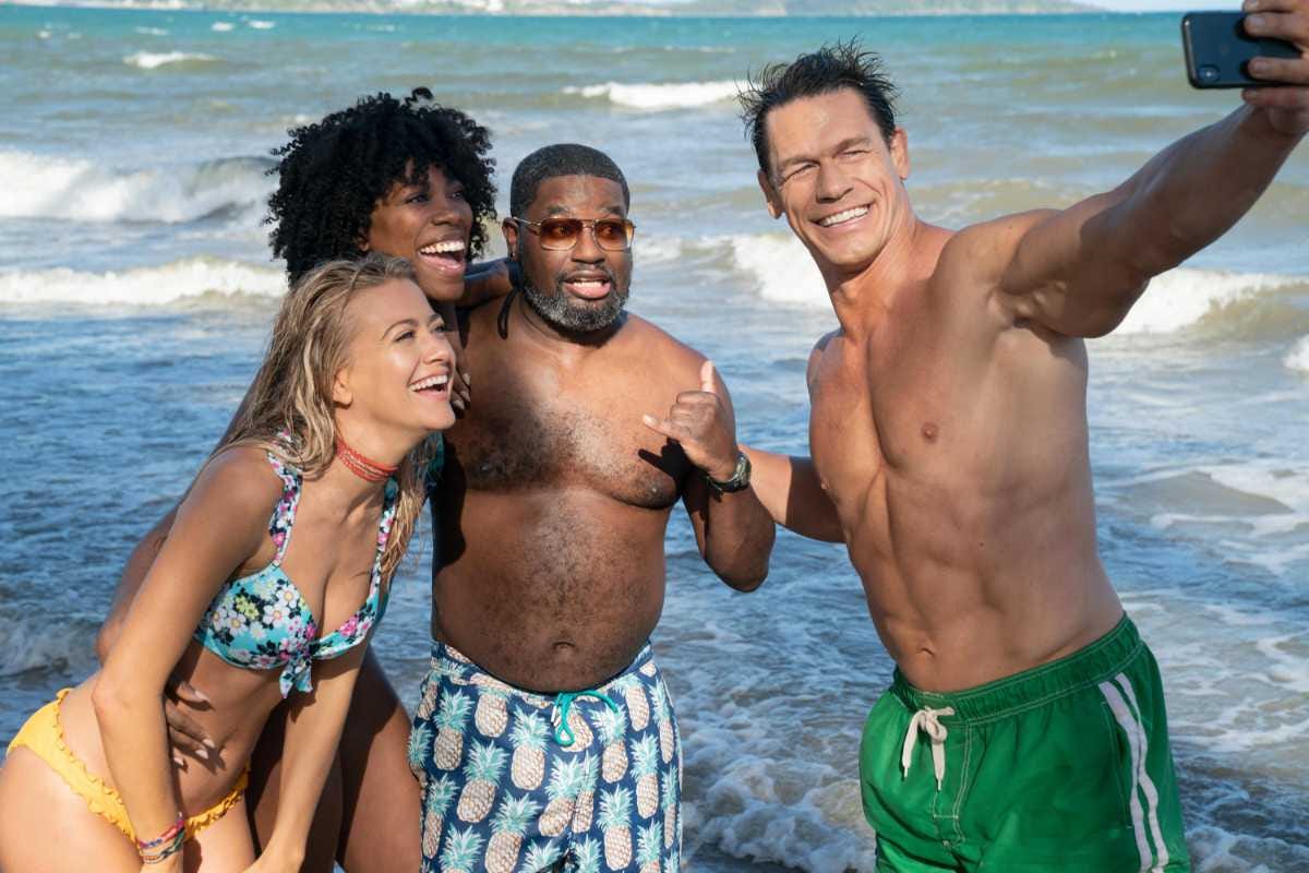 Still from Hulu's Vacation Friends including a shirtless John cena taking a selfie