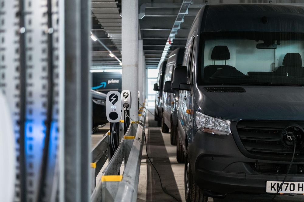 Amazon vans plugged into EO Charging’s stations.