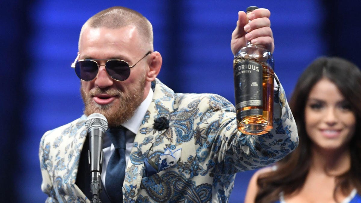 McGregor shows up to press conference with a bottle of his own 'Notorious'  whiskey - CBSSports.com