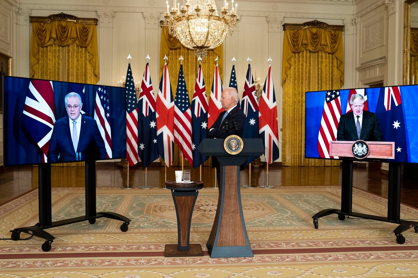 President Joe Biden, participates in a videoconference with Prime Minister Scott Morrison of Australia, left, and Prime Minister Boris Johnson of the United Kingdom, from the White House in Washington on Wednesday, Sept.15, 2021. France reacted with fury on Thursday to President Biden’s announcement of a deal to help Australia deploy nuclear-powered submarines, calling it a “unilateral, brutal, unpredictable decision” that resembled the rash and sudden policy shifts common during the Trump administration.