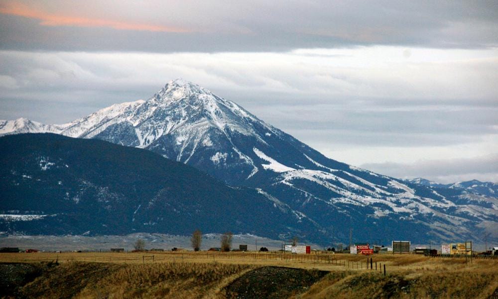 FILE - Emigrant Peak towers over the Paradise Valley in Montana north of Yellowstone National Park, on Nov. 21, 2016. Park County authorities said Friday, March 25, 2022, that a hiker was killed in the area in a suspected encounter with a grizzly bear. (AP Photo/Matthew Brown, File)