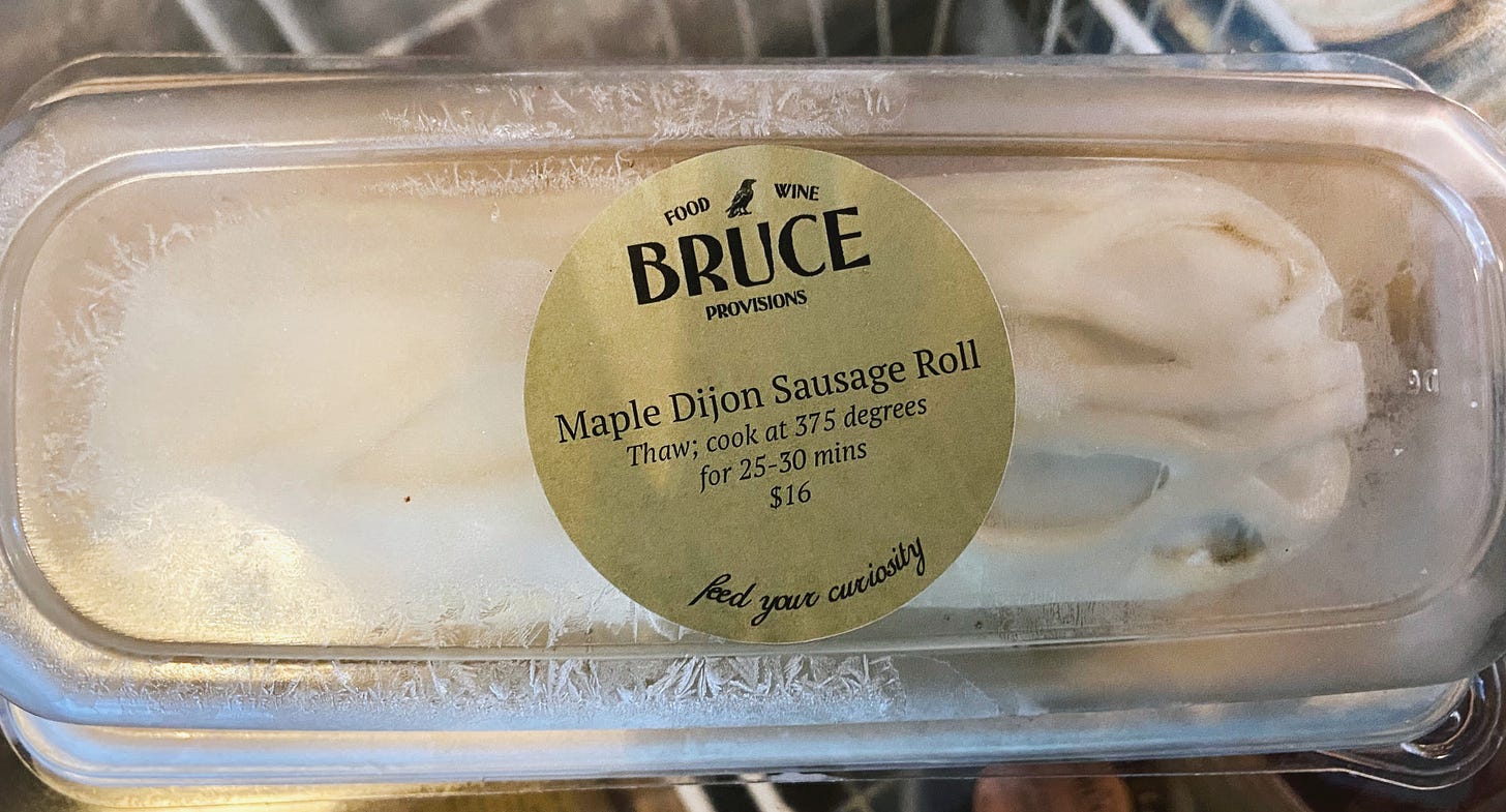 Frozen maple dijon sausage roll in a container