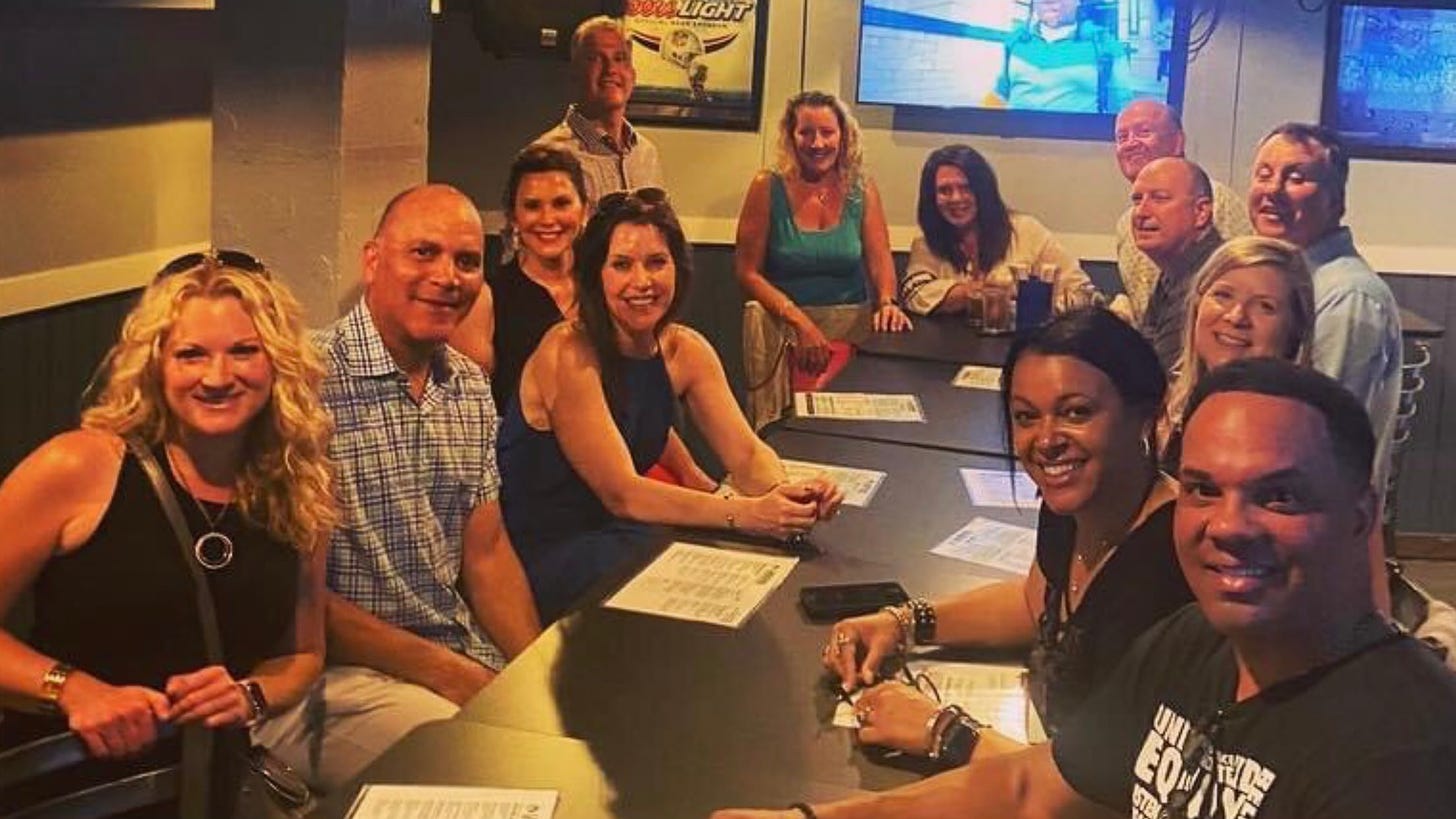 Michigan Gov. Whitmer apologizes after photo surfaces showing her violating  COVID distancing order at East Lansing bar | Crain's Detroit Business