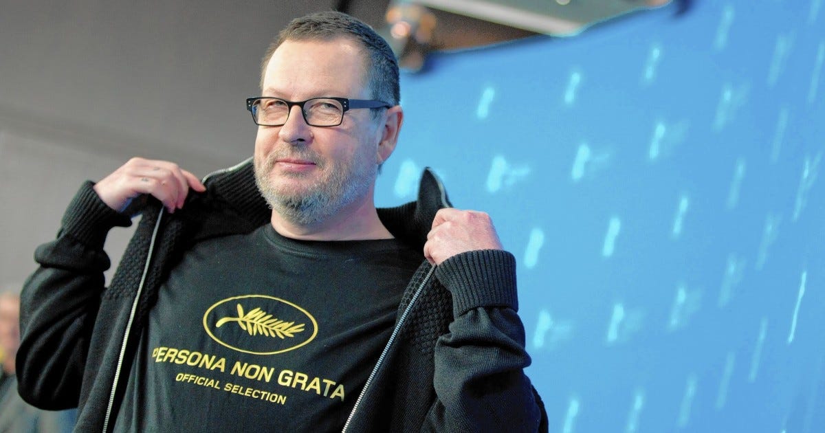 Lars von Trier showing off his Persona Non Grata Cannes shirt