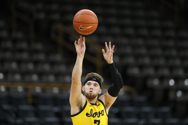 Iowa guard Jordan Bohannon warms up before an NCAA college basketball game against Nebraska, Saturday, Feb. 8, 2020, in Iowa City. [Charlie Neibergall/Associated Press]