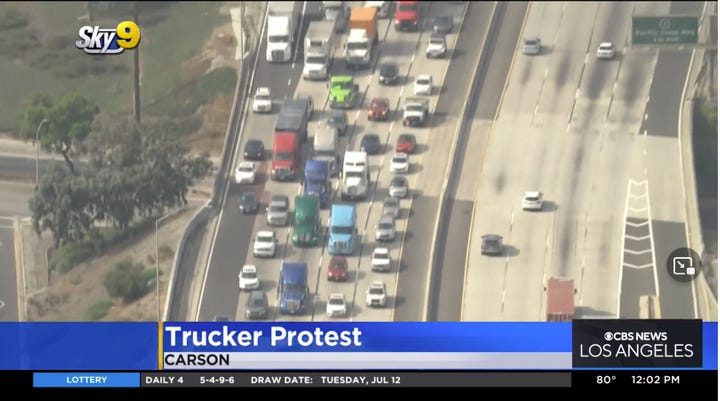 Independent truckers stopped work and took to southern California highways to protest Assembly Bill 5.  -  Screen capture of CBS Los Angeles news report