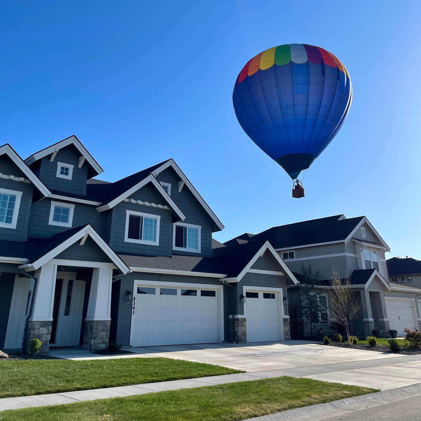 Balloon floating over home