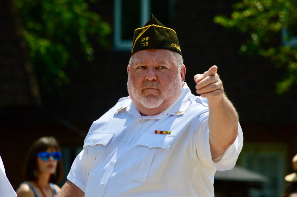 Mokena VFW Post 725 Cmdr. James Hogan thanks parade attendees for standing for the flag as the members of the VFW passed by Sunday, July 4.