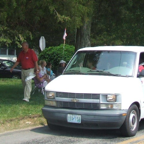 District 38A Delegate Page Elmore walks alongside his campaign van.