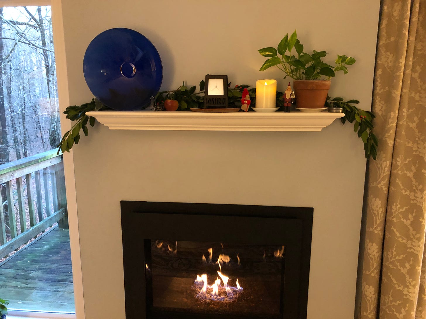 My fireplace mantel, literally decked with holly and Julenisse