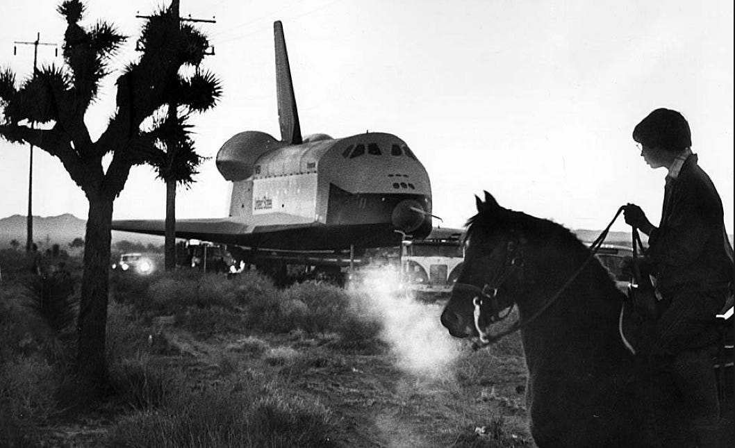 A horse and rider watch as the space shuttle Enterprise is towed from a  Rockwell International facility … | Space shuttle enterprise, Horses,  Rockwell international
