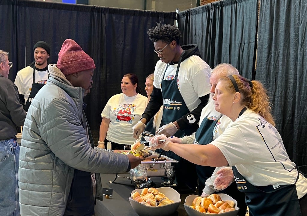 Tyrese’s mom, Jalen Smith and others helped serve a warm meal to over 600 people from local Indy shelters.