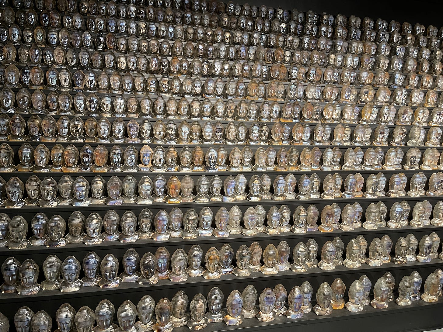 Hundreds of glass Buddha heads