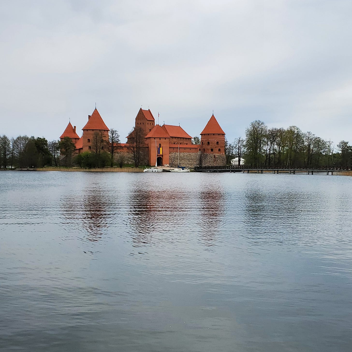 A restored medieval castle on a lake. 
