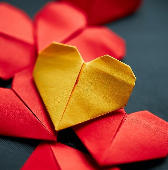 Yellow and red paper hearts. Photo by Dirk Ribbler on Unsplash.