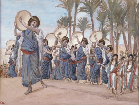 Women with timblrels singing and dancing 